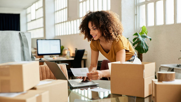 Small merchant shipping goods to her clients